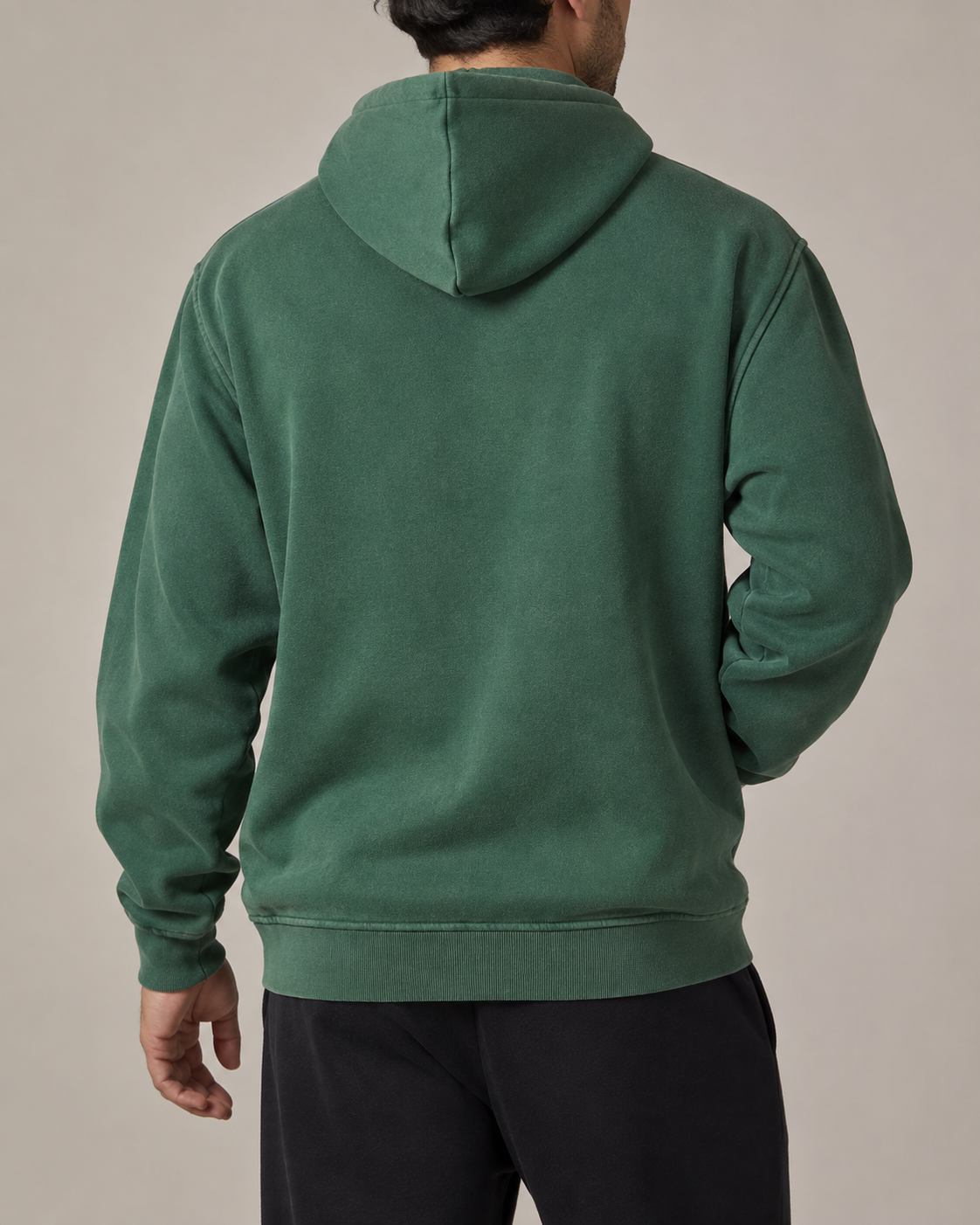 Back studio view of the plain TELLS Evergreen Washed Hoodie in Dark Green, showing the hood and relaxed shape.