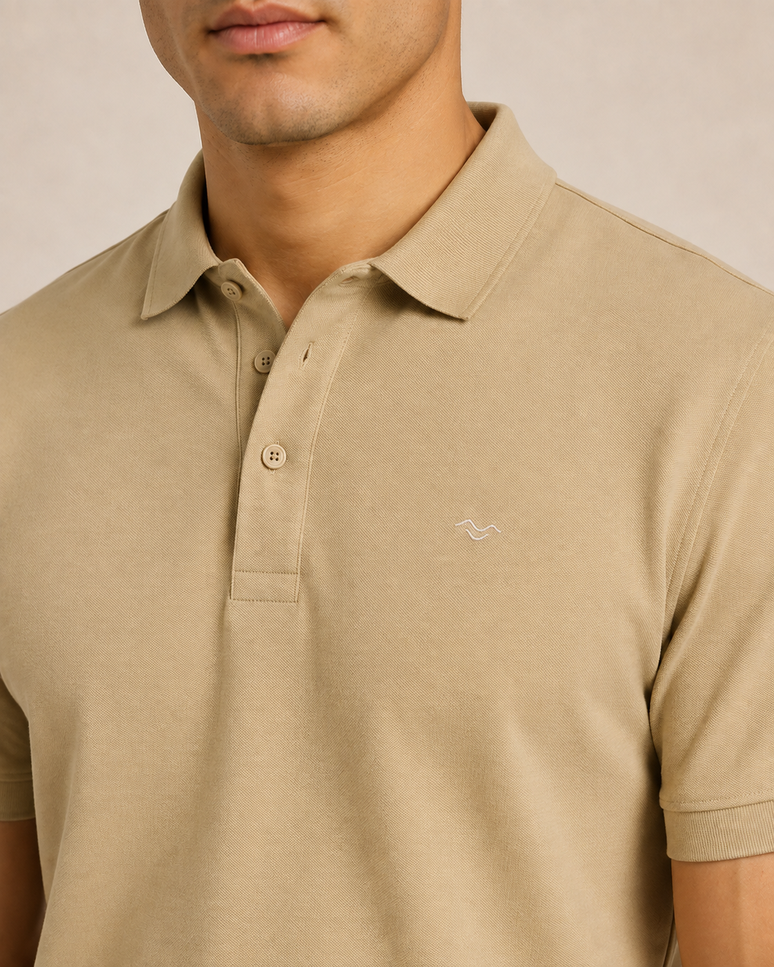 Meridian Pique Polo in Sand embroidery detail