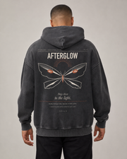 TELLS Afterglow Poster Hoodie in Black, rear studio hero with full Afterglow moth poster