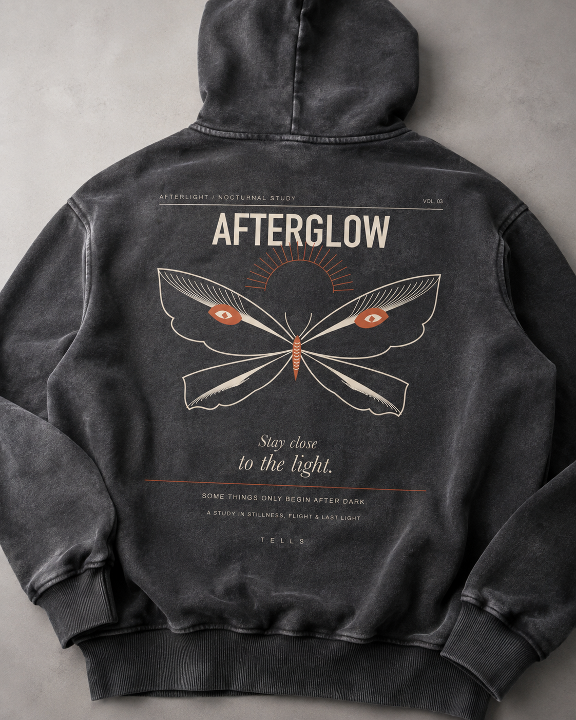 TELLS Afterglow Poster Hoodie in Black, close-up of Afterglow poster print and washed texture