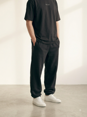TELLS Embroidered Oversized Black T-Shirt — cropped below face