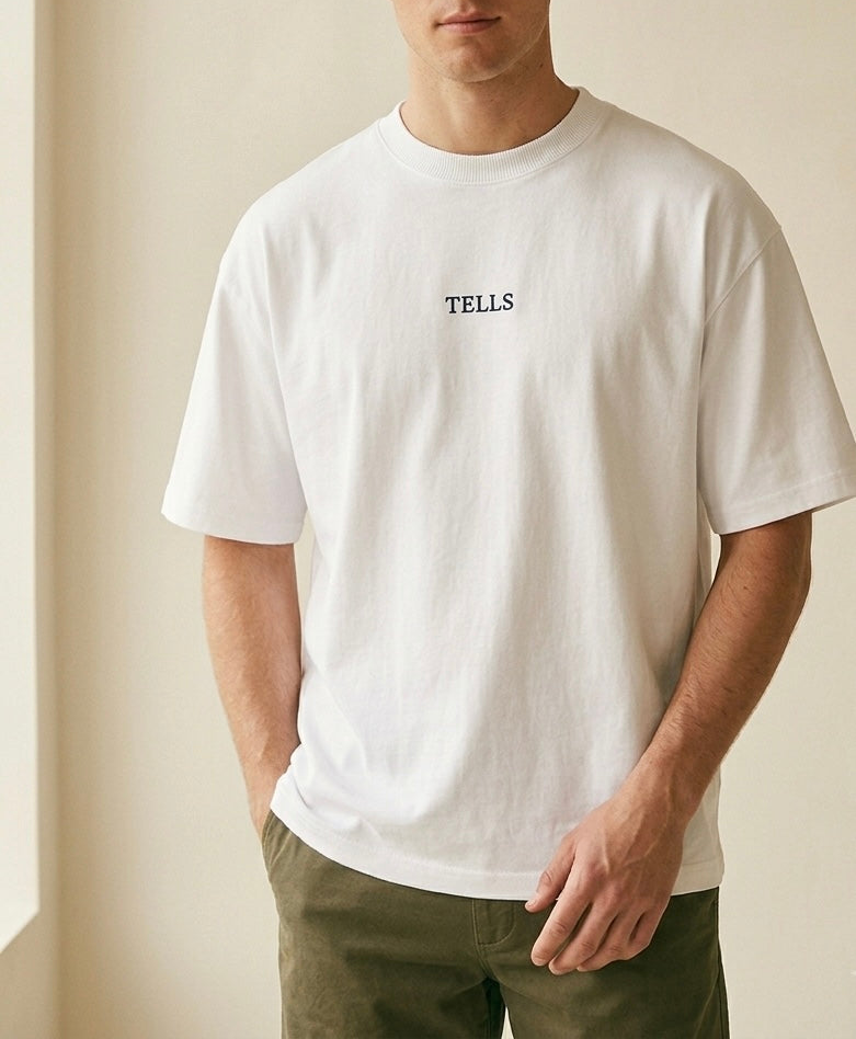 TELLS Embroidered Oversized White T-Shirt — cropped below face