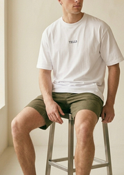 TELLS Embroidered Oversized White T-Shirt — cropped below face