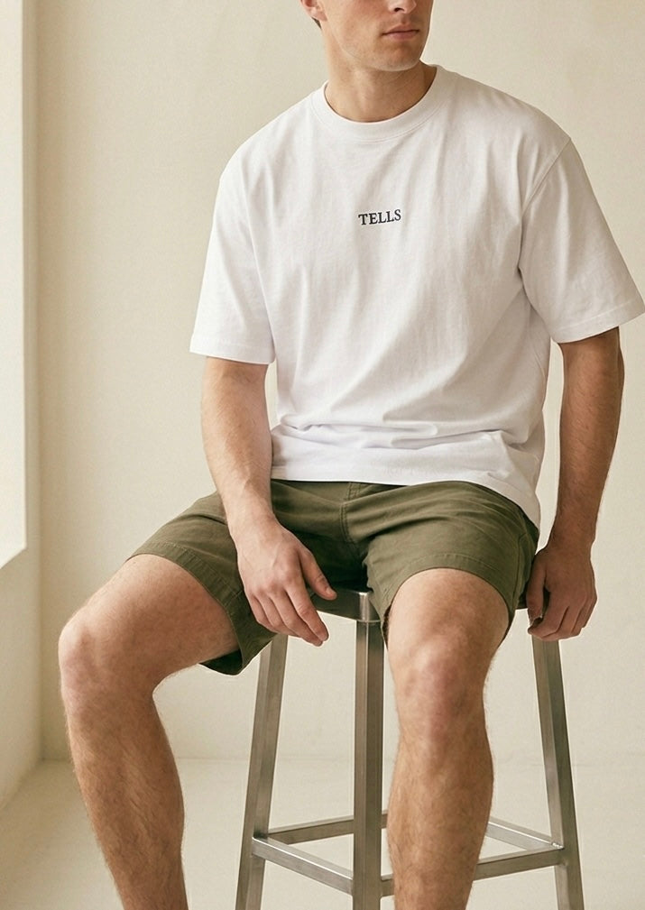 TELLS Embroidered Oversized White T-Shirt — cropped below face