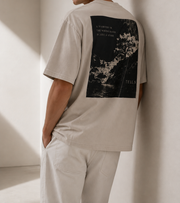 TELLS Faded Oversized Bone T-Shirt — cropped below face