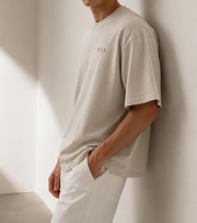 TELLS Faded Oversized Bone T-Shirt — cropped below face