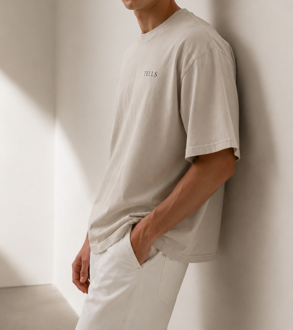 TELLS Faded Oversized Bone T-Shirt — cropped below face