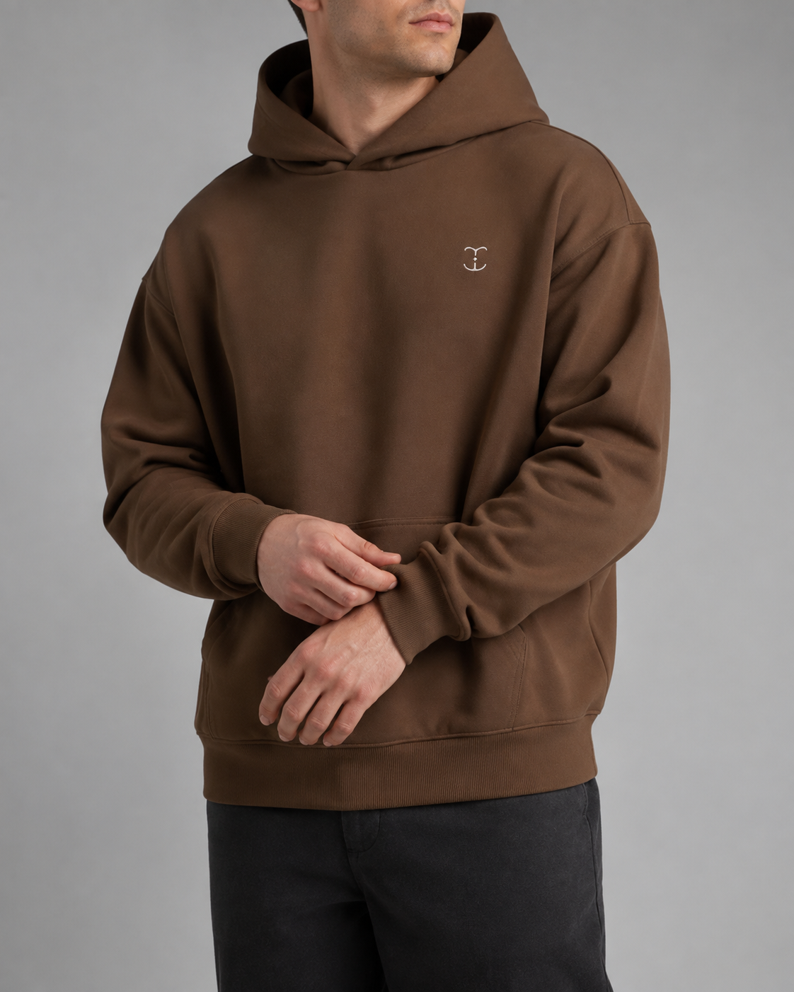 TELLS Signature Coffee Hoodie, three-quarter front studio view