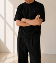 TELLS Signature Oversized Black T-Shirt — cropped below face