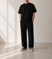 TELLS Signature Oversized Black T-Shirt — cropped below face