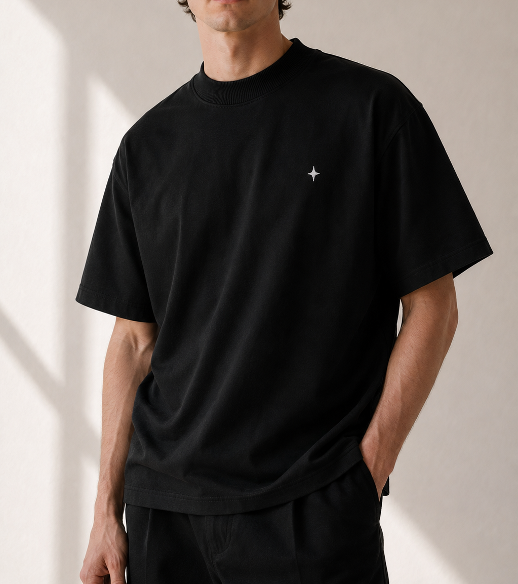 TELLS Signature Oversized Black T-Shirt — cropped below face