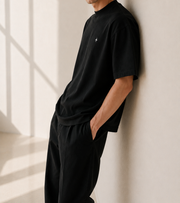 TELLS Signature Oversized Black T-Shirt — cropped below face