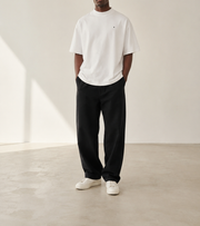 TELLS Signature Oversized White T-Shirt — cropped below face
