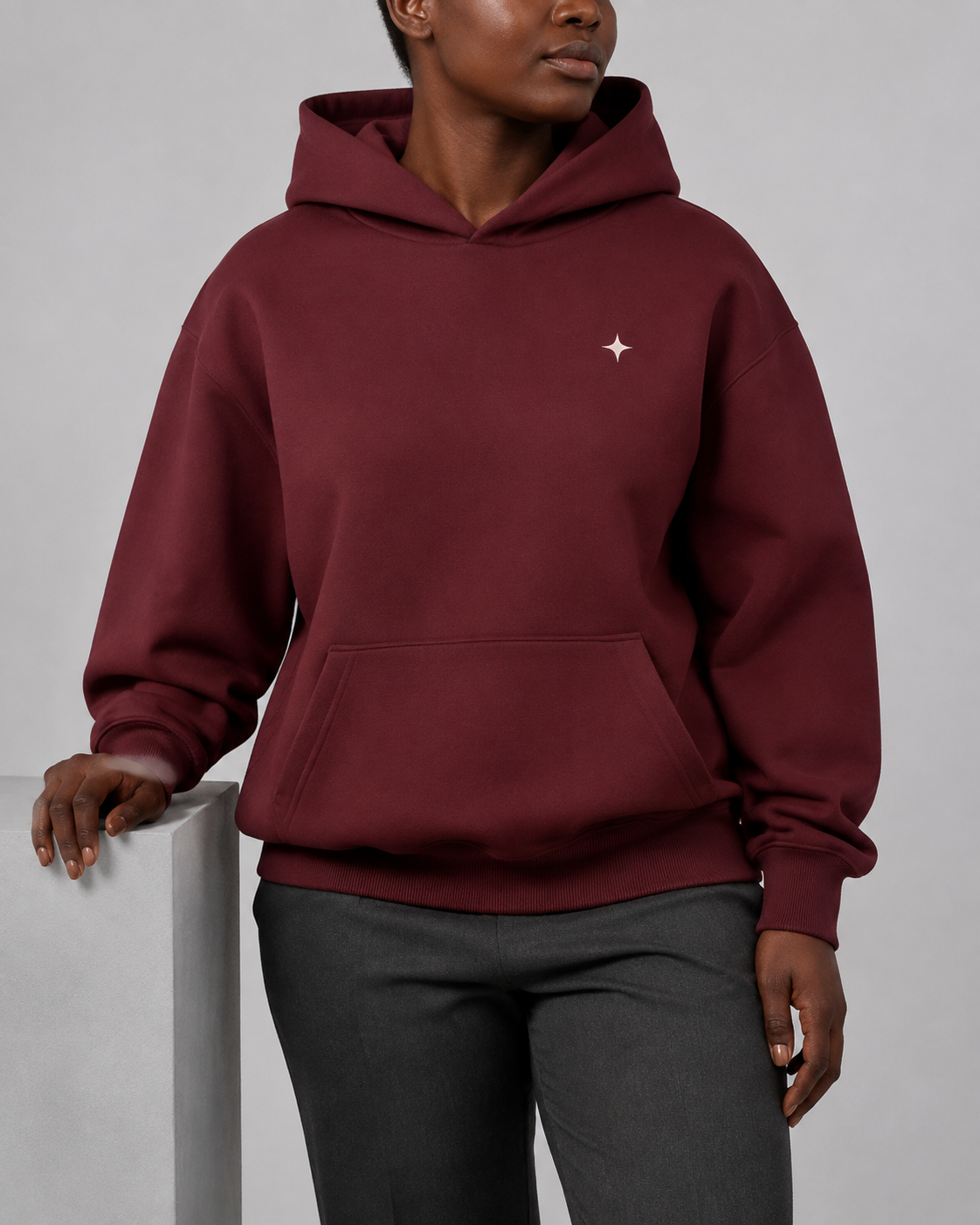 TELLS Dusk Atlas Hoodie in Dull Red, front studio view with ivory Sub Logo