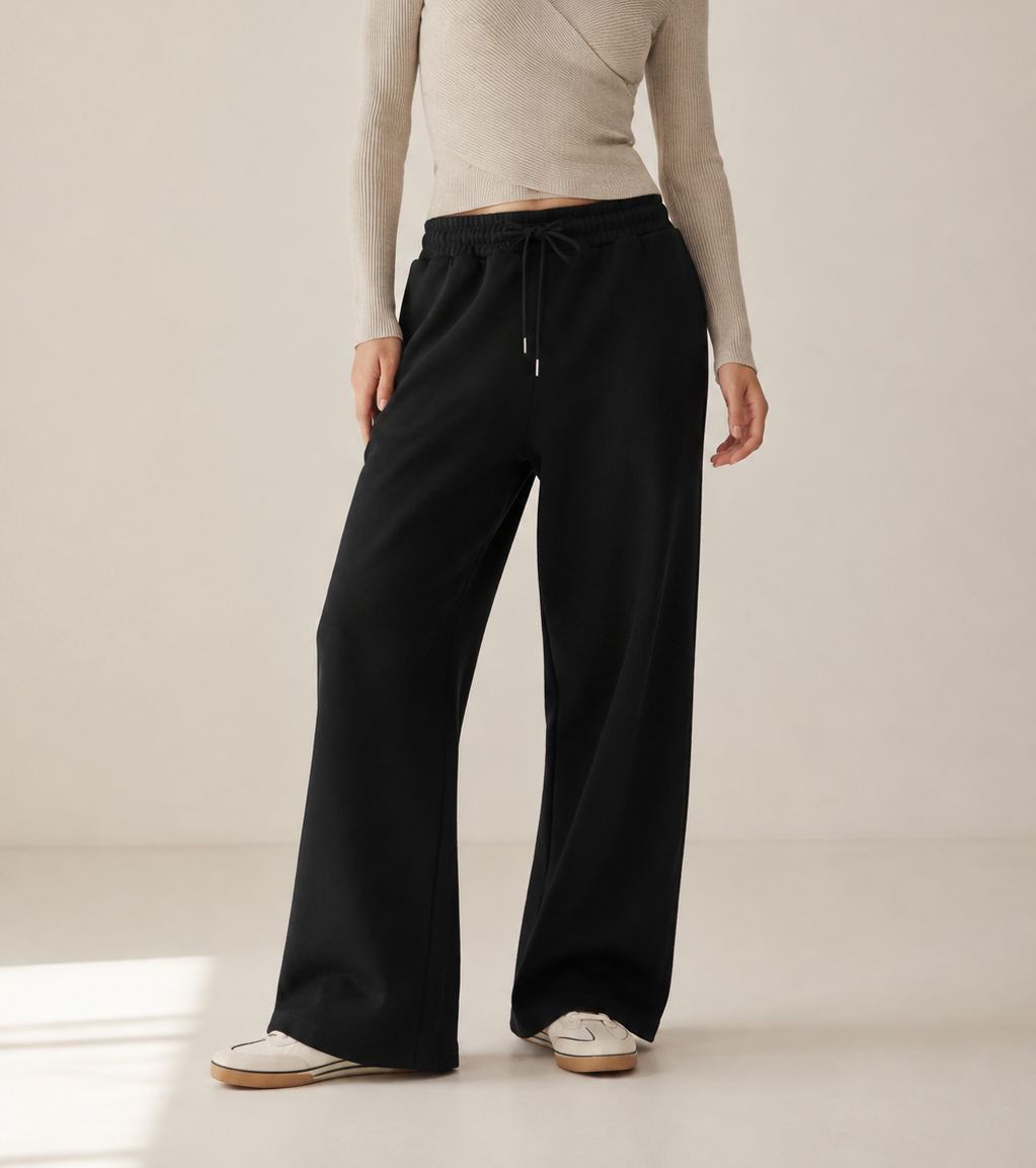 Women’s TELLS Essential Wide-Leg Black Sweatpants — cropped below face