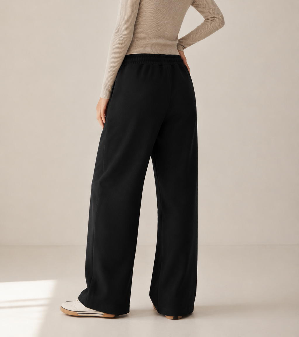 Women’s TELLS Essential Wide-Leg Black Sweatpants — cropped below face