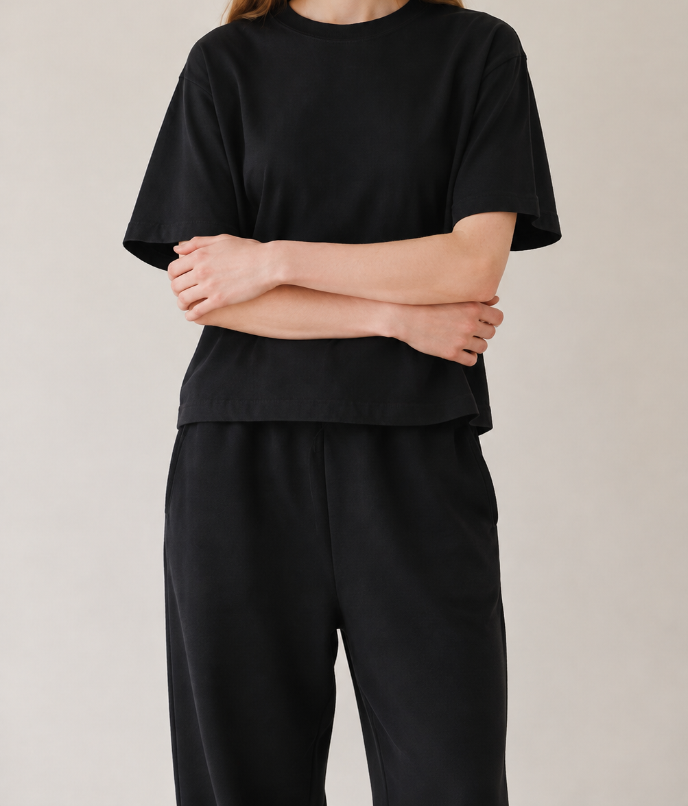 Women’s TELLS Real Flex Black Boxy Tee — cropped below face