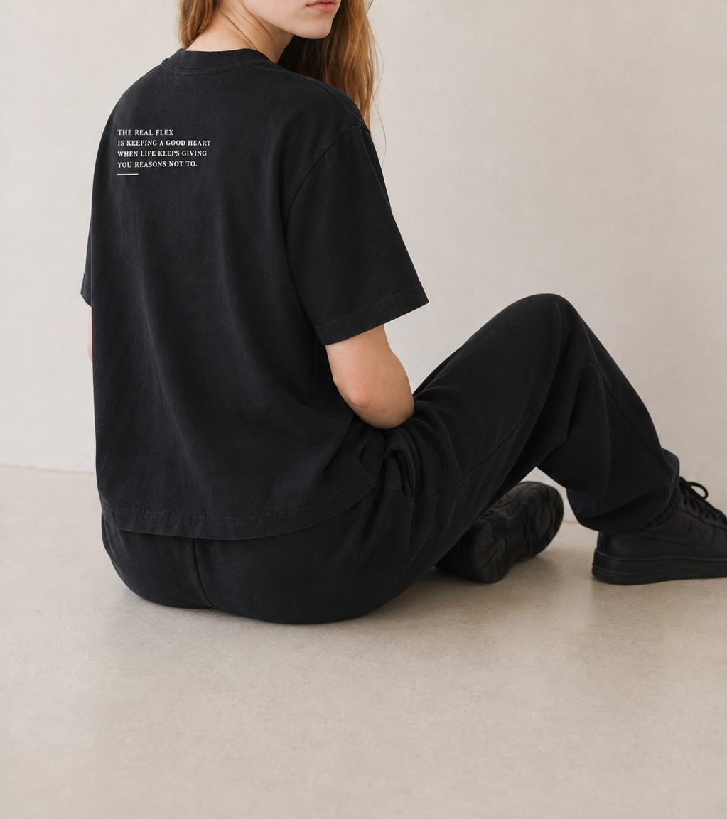 Women’s TELLS Real Flex Black Boxy Tee — cropped below face