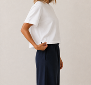 Women’s TELLS Real Flex White Boxy Tee — cropped below face
