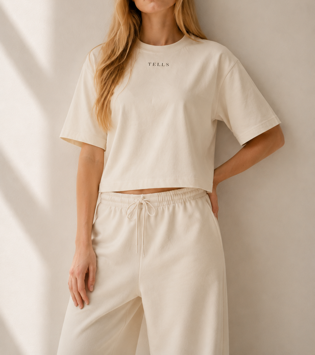 Women’s TELLS Signature Beige Boxy Tee — cropped below face
