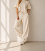 Women’s TELLS Signature Beige Boxy Tee — cropped below face