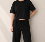 Women’s TELLS Signature Black Boxy Tee — cropped below face