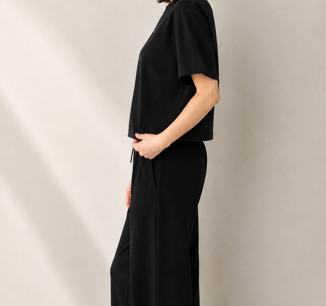Women’s TELLS Signature Black Boxy Tee — cropped below face