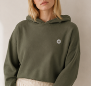 Women’s TELLS Signature Cropped Olive Hoodie — cropped below face