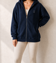 Women’s TELLS Signature Navy Zip Hoodie — cropped below face