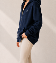 Women’s TELLS Signature Navy Zip Hoodie — cropped below face