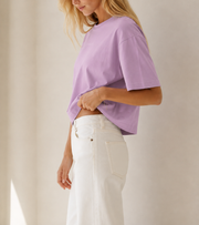 Women’s TELLS Signature Pink Boxy Tee — cropped below face